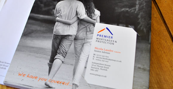 A folder and business card for Premier designed by Solid Block